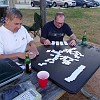 Gary, Patrick and I were playing chicken feet domino.<br>Gary, Patrick e eu jogamos muito dominó pé-de-galinha.